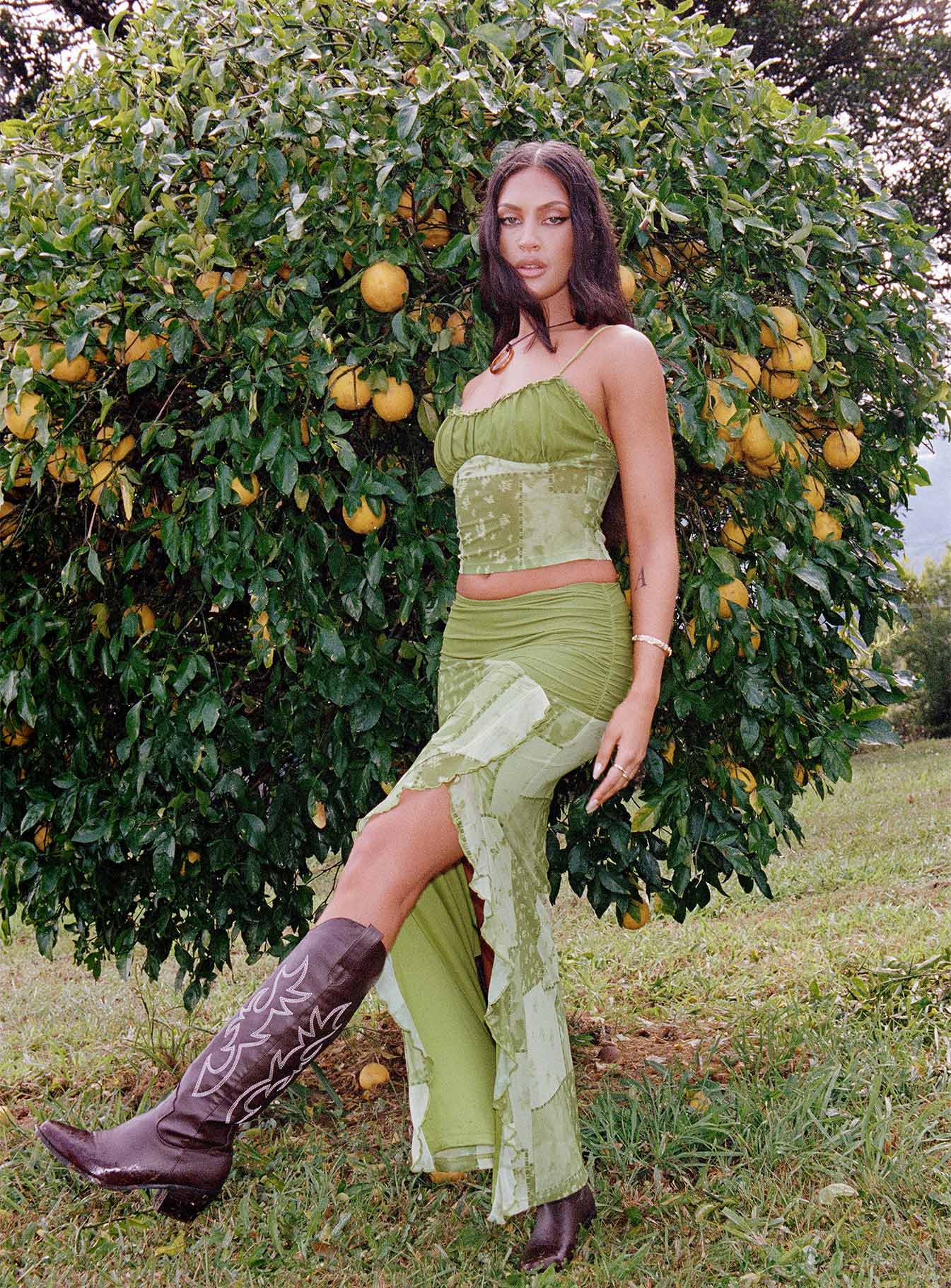 Front view of model wearing  front Princess Polly Sleeveless High Neck  Sharifa Patchwork Top Green