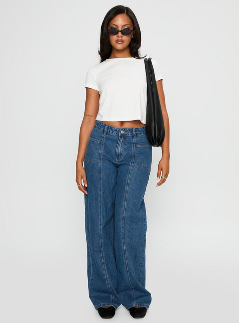 side view of model wearing Princess Polly Taji Wide Leg Jeans Dark Blue Mid Rise 