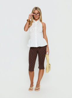 side view of model wearing Princess Polly Samaira Capri Pant Brown Polka Dot Mid Rise Pants 