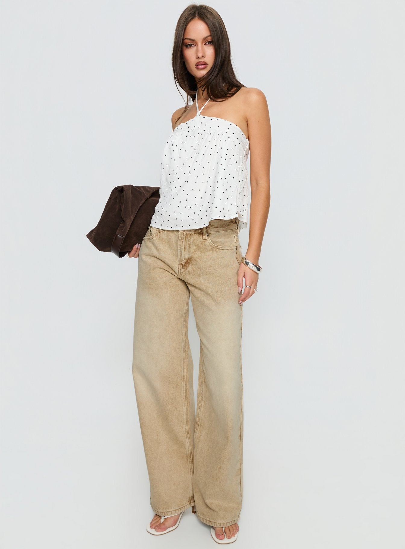 back view of model wearing Princess Polly Serenitia Mid Rise Relaxed Jeans Sandy Brown Wash Mid Rise Jeans 