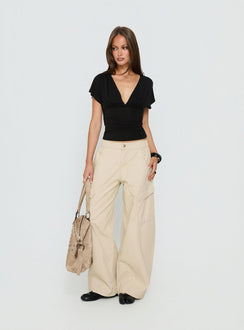 front view of model wearing Princess Polly Selective Memory Low Rise Wide Leg Cargo Pants Cream Low Rise Pants 