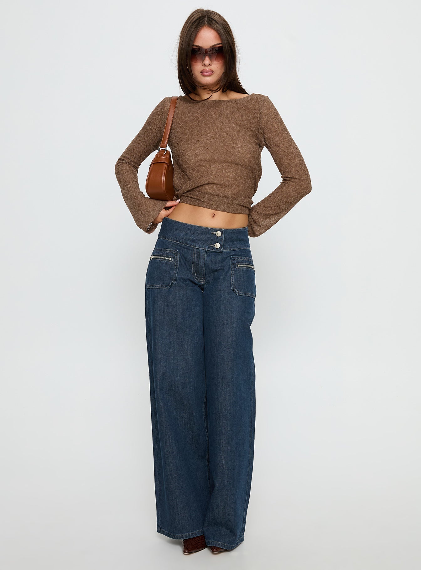 front view of model wearing Princess Polly Unwritten Mid Rise Wide Leg Jeans Dark Blue Wash Mid Rise Jeans 