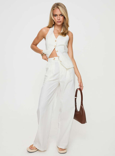 White Matching linen set Halter neck top, fixed halter strap, button fastening at front, twin hip pockets High rise pants, belt looped waist, zip and button fastening, elasticated waistband at back, twin hip pockets, straight leg
