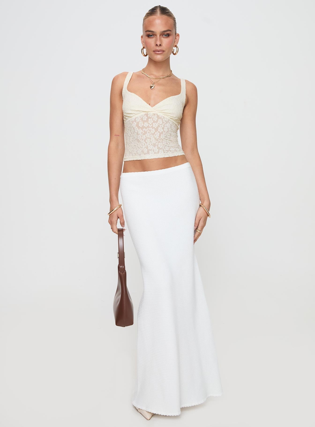 side view of model wearing Princess Polly Wandella Top Cream Sleeveless Plunger 