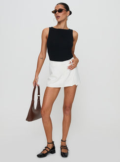 front view of model wearing Princess Polly Deuce Split Skort White High Waisted Shorts 