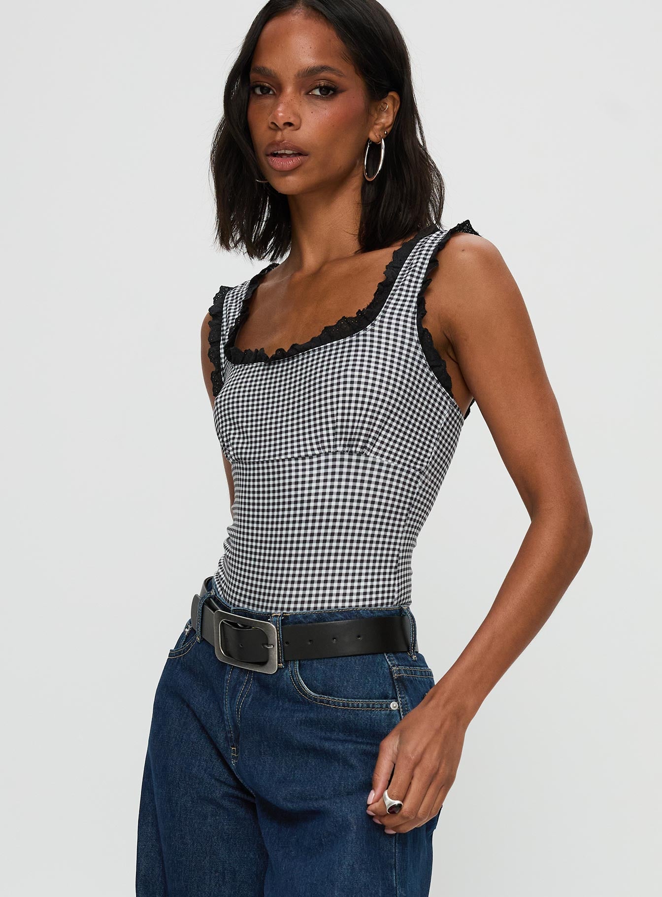 side view of model wearing Princess Polly Trustfund Lace Trim Bodysuit Black / White Check Sleeveless 