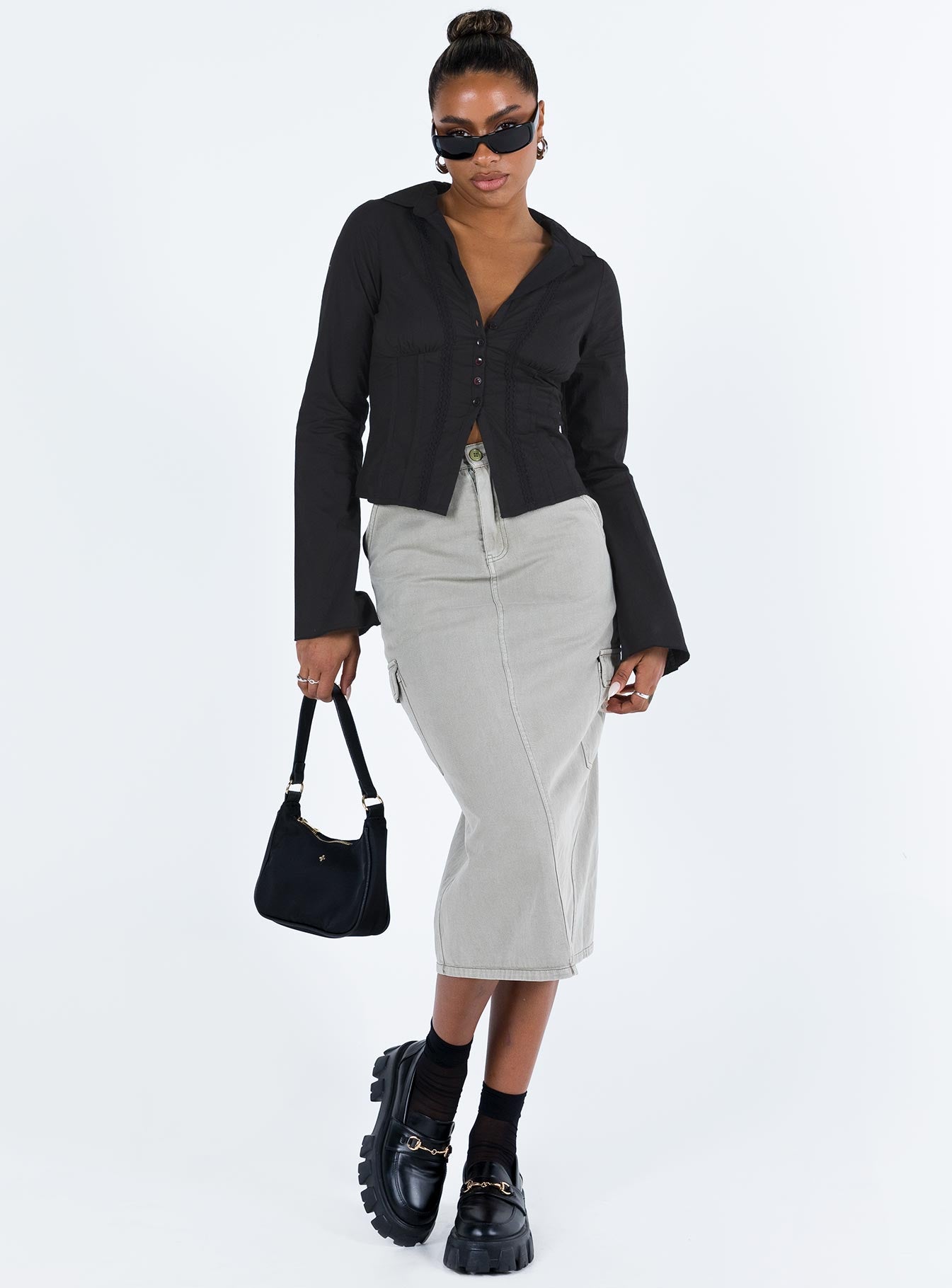 Shirt V neckline Classic collar Slight ruching at bust Button fastening at front Knitted lace detail Flared cuff