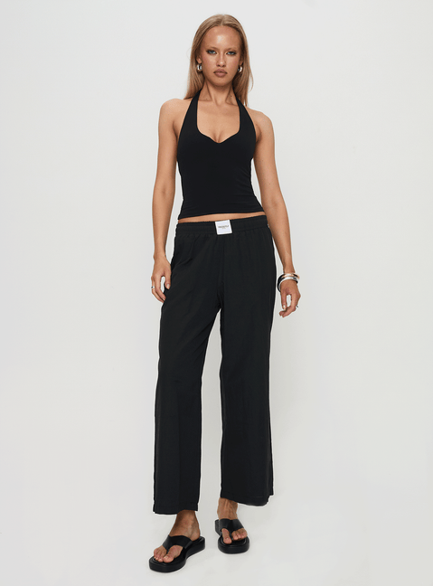 front view of model wearing Princess Polly Beach House Pants Black Low Rise Pants 