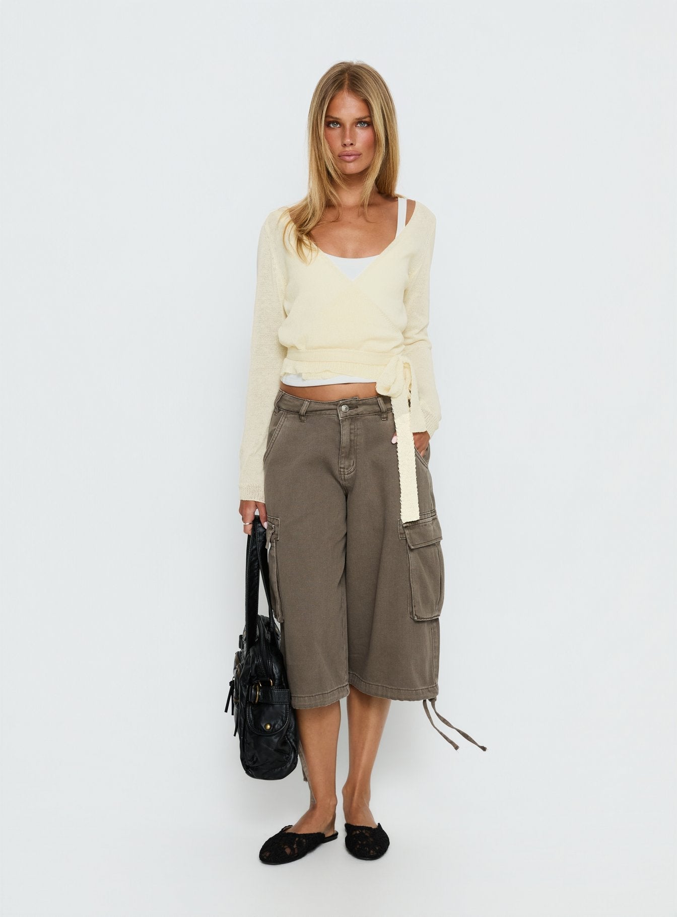 back view of model wearing Princess Polly Tonee Sheer Wrap Knit Cardigan Butter Cream cropped 