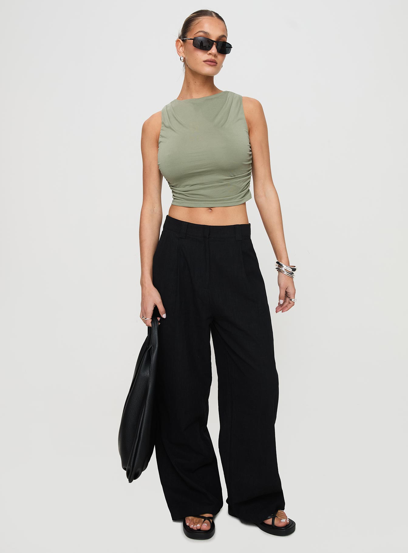 front view of model wearing Princess Polly Hold Em High Neck Top Green Sleeveless Crew Neck 