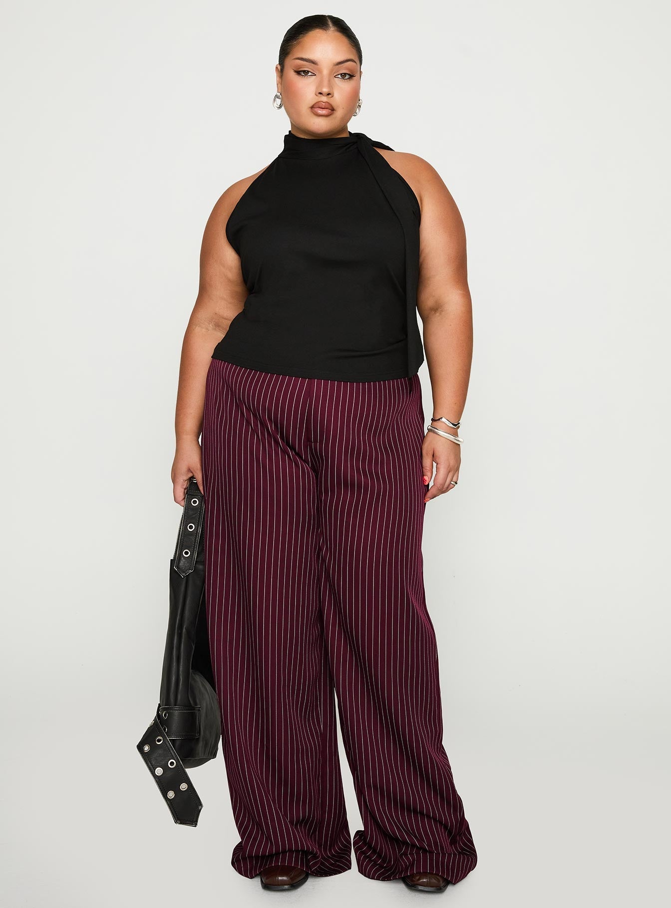 front view of model wearing Princess Polly Lorenne Mid Rise Pant Burgundy Pinstripe Curve 