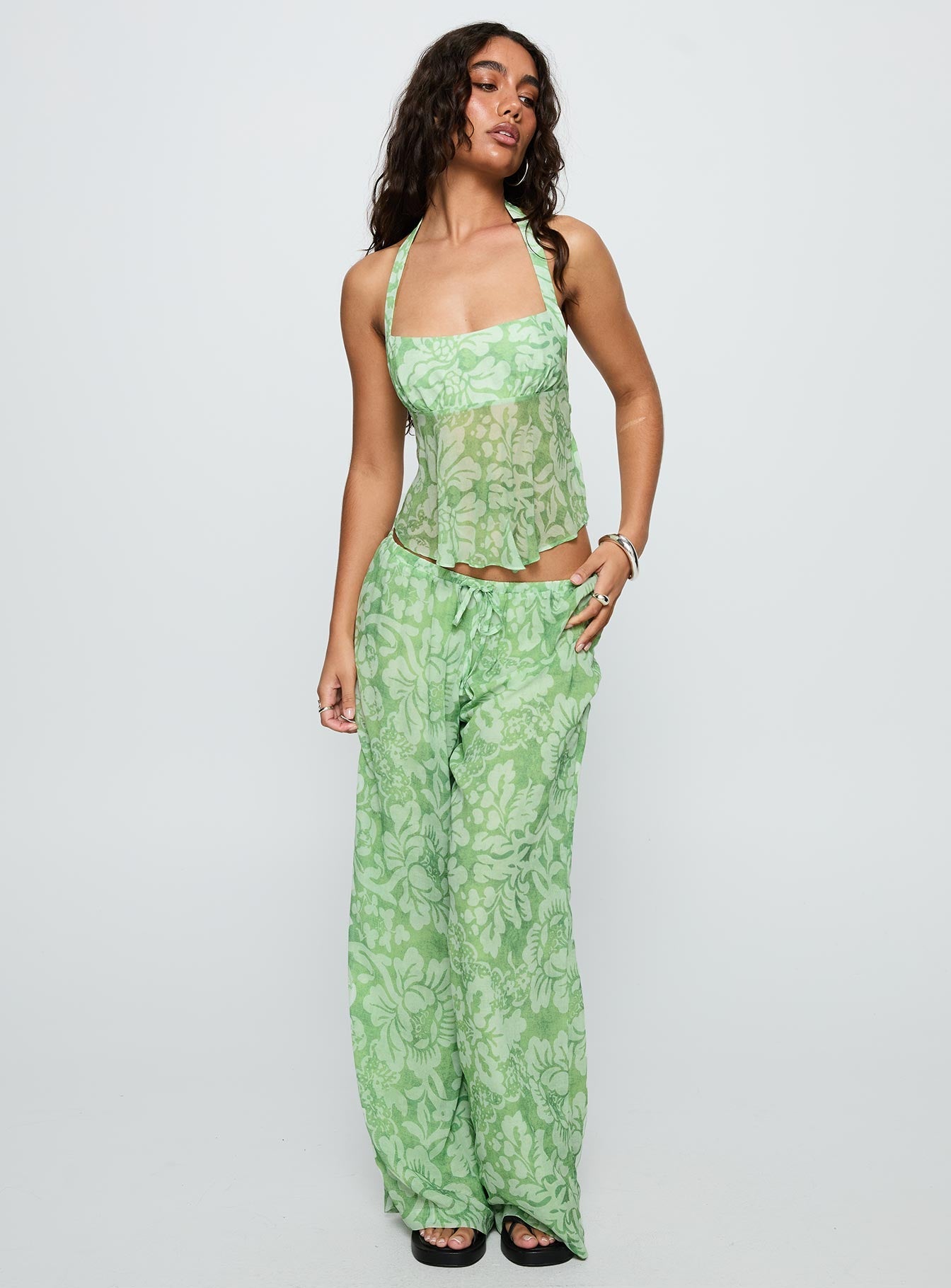 front view of model wearing Princess Polly Finesse Pants Green Floral High Waisted Pants 