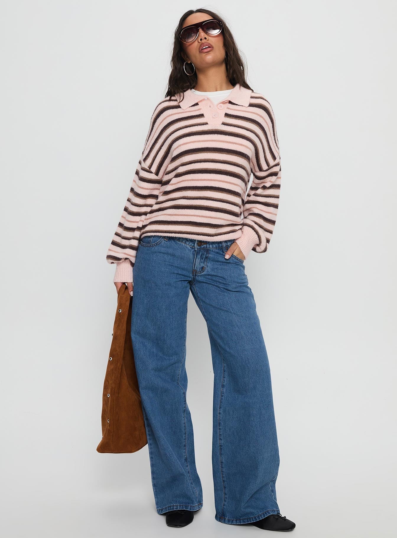 front view of model wearing Princess Polly Highlands Low Rise Wide Leg Jeans Mid Blue Wash Low Rise Jeans 