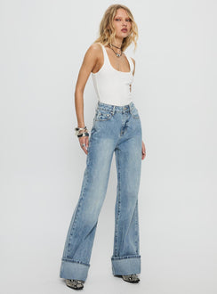side view of model wearing Princess Polly Florida Keys Mid Rise Straight Leg Cuffed Jeans Light Blue Wash High Waisted Jeans 