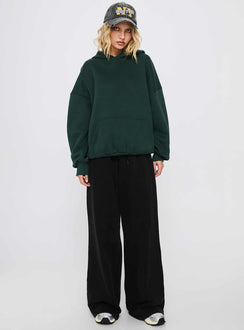 side view of model wearing Princess Polly Good Luck Graphic Hoodie Green / Blue Long 