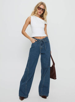 front view of model wearing Princess Polly Bruiser Mid Rise Wide Leg Jeans Mid Blue Wash Mid Rise Jeans 