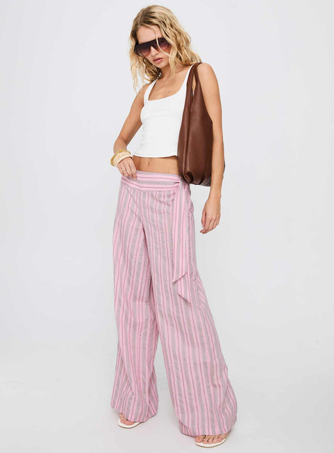 side view of model wearing Princess Polly Wave Dancer Tie Pant Pink Stripe High Waisted Pants 