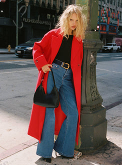 front view of model wearing Princess Polly Lucille High Rise Flare Leg Jeans Mid Wash High Waisted 