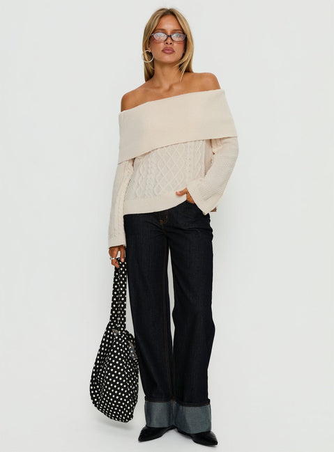 Featuring the Margarete Off Shoulder Knit Sweater Cream womens jumper with short length and oversized fit front view of model wearing Princess Polly