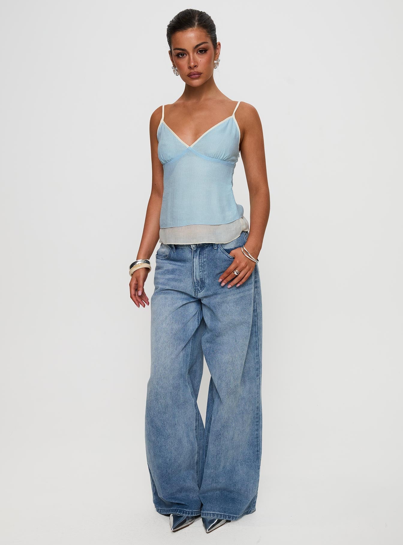 side view of model wearing Princess Polly Majorie Layered Top Blue / Cream Sleeveless V-Neck 