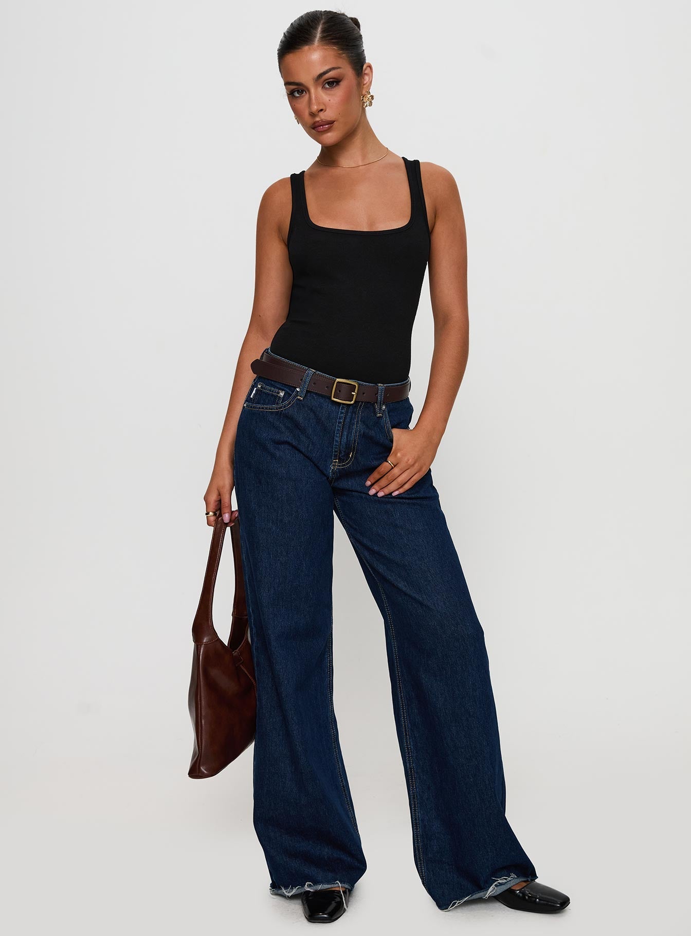 side view of model wearing Princess Polly Baseline Rib Bodysuit Black Sleeveless 