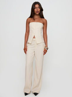 side view of model wearing Princess Polly Lavish Living Strapless Top Cream Sleeveless straight 