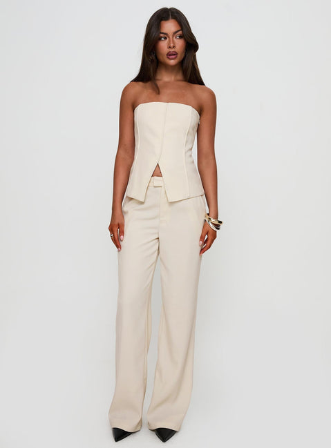 side view of model wearing Princess Polly Lavish Living Strapless Top Cream Sleeveless straight 