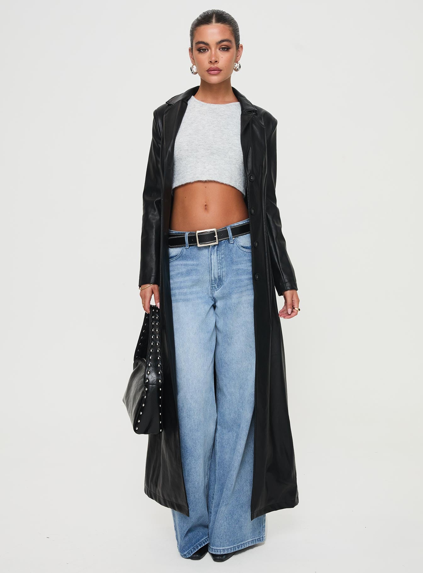 <ul> <li>Faux leather coat</li> <li>Lapel collar, button fastening down front, shoulder pads</li> </ul>