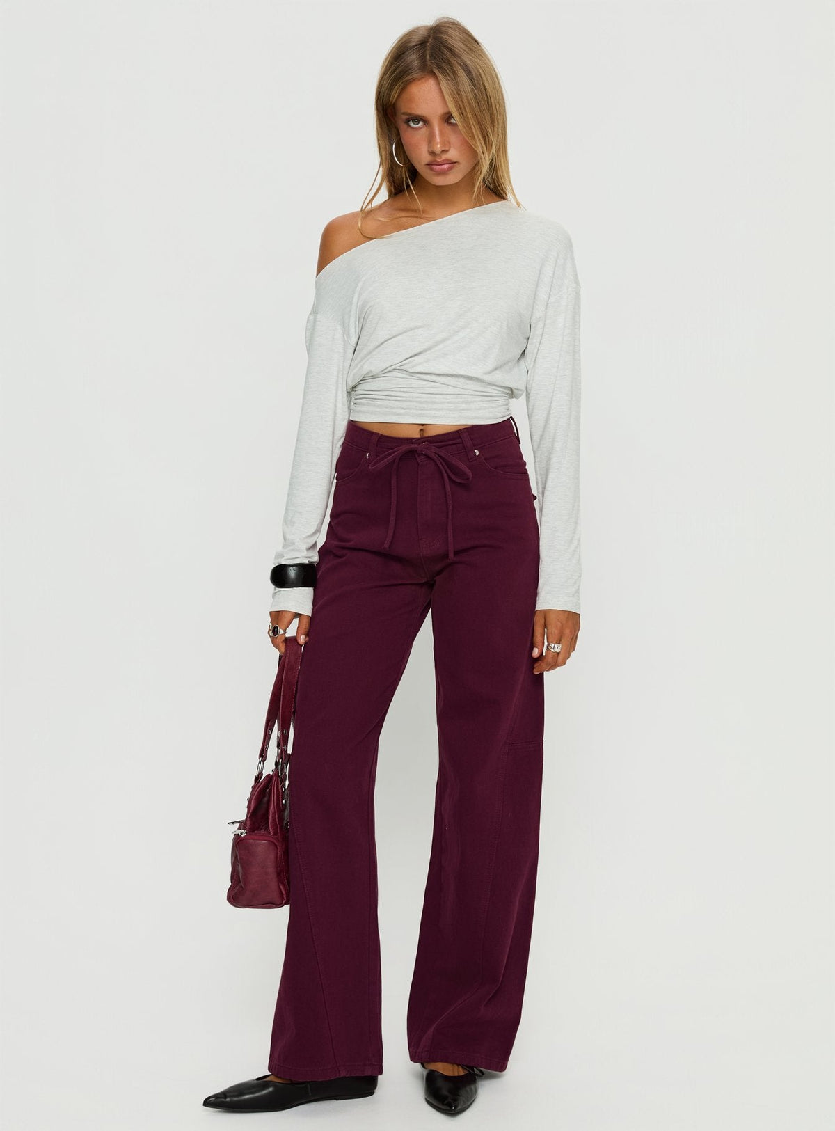 side view of model wearing Princess Polly Bruiser Tie Waist Mid Rise Wide Leg Jeans Currant High Rise Jeans Jeans 