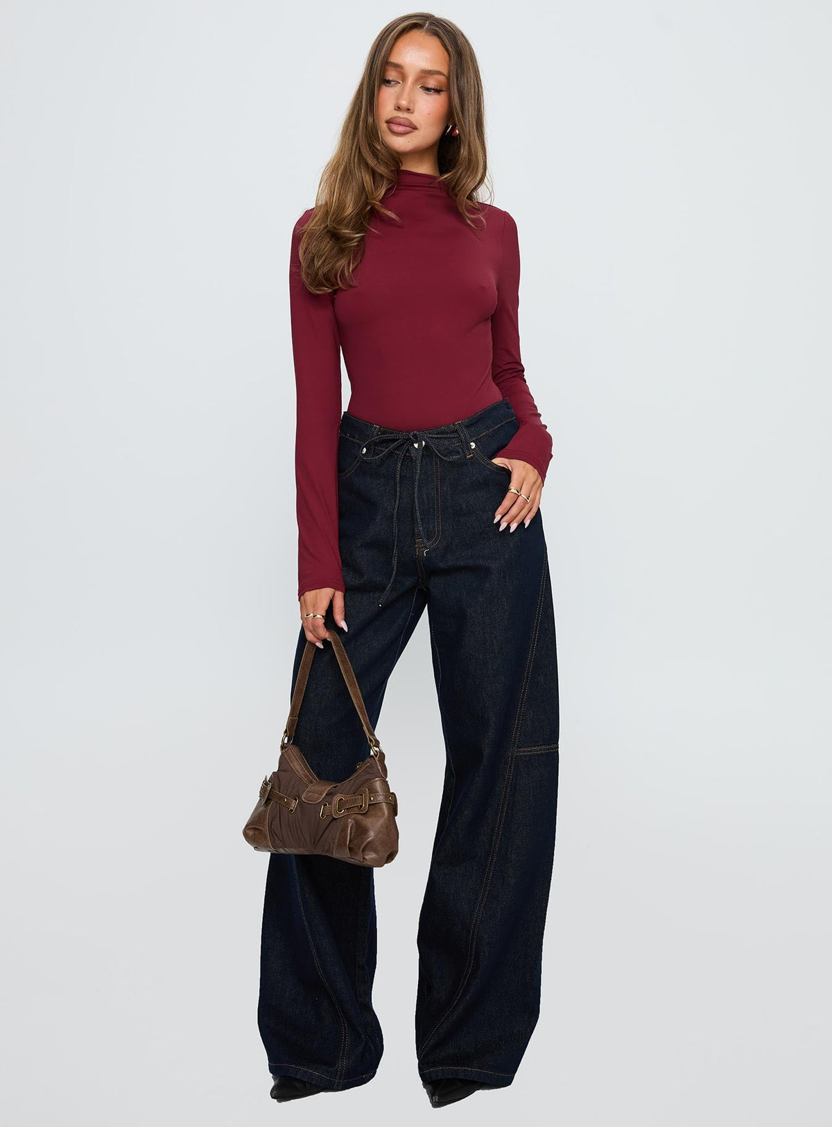 front view of model wearing Princess Polly Augustness Long Sleeve Bodysuit Burgundy Long Sleeve Tops Bodysuit 