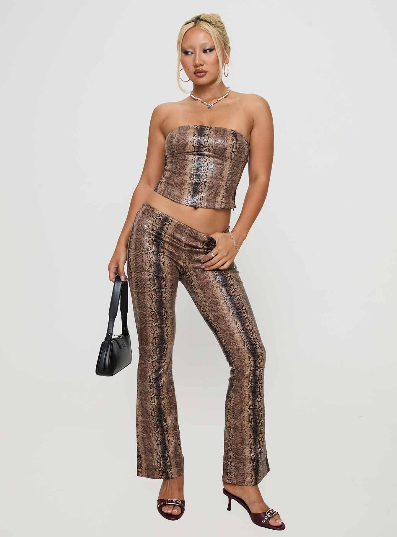 side view of model wearing Princess Polly Kinniya Strapless Top Brown Multi Sleeveless straight 