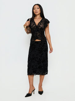 back view of model wearing Princess Polly Atira Midi Skirt Leaf Flower Black Midi Skirts 