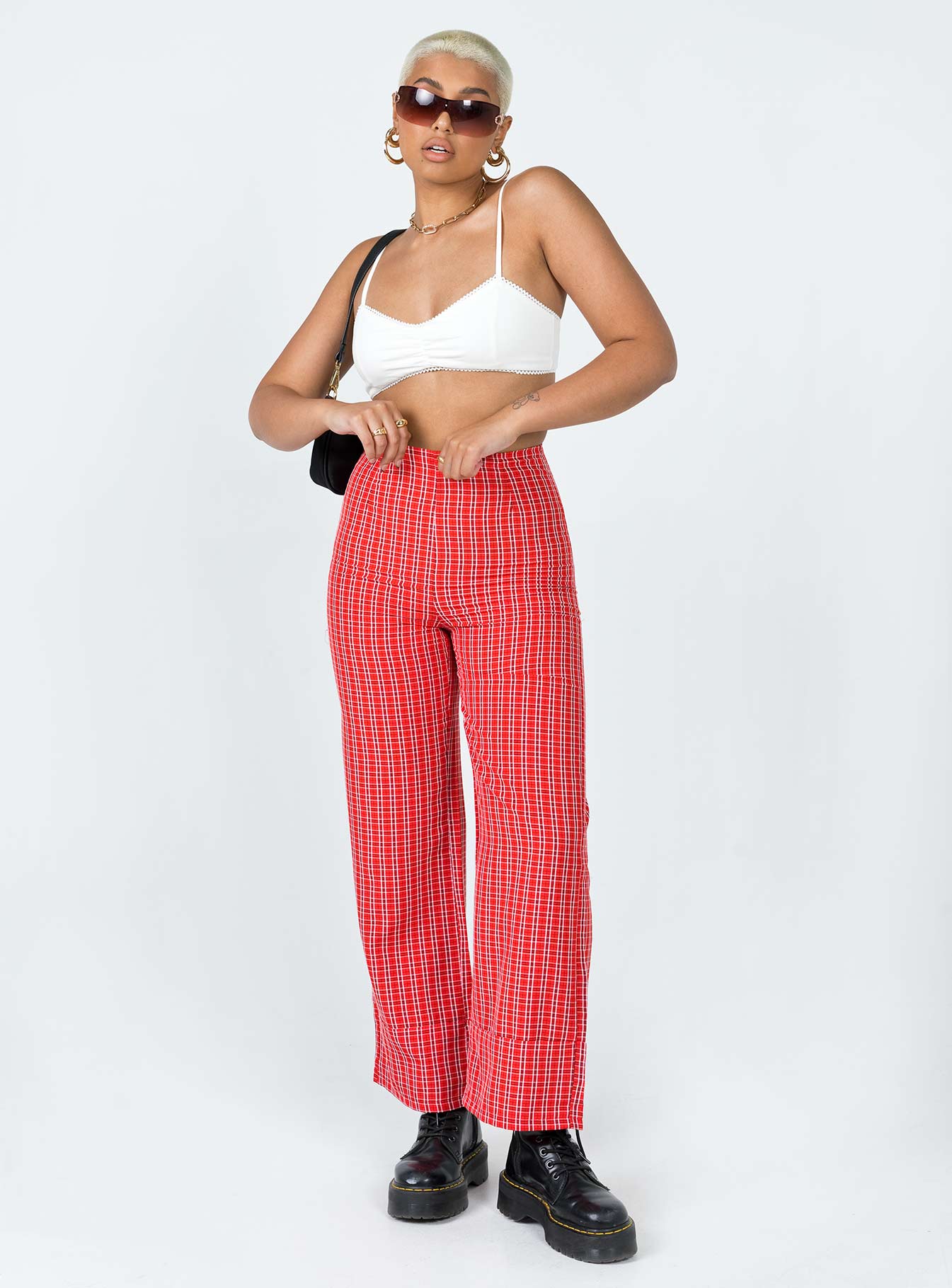 side view of model wearing Princess Polly Euros Pants Red Tartan 