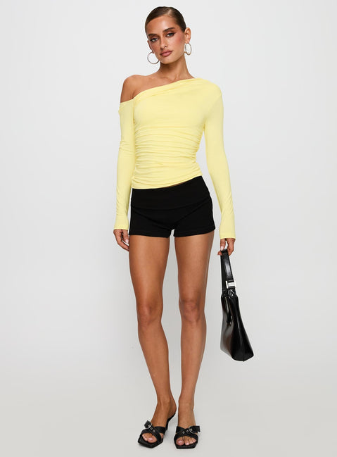 back view of model wearing Princess Polly Beller Long Sleeve Top Lemon Full Sleeves Asymmetric Neckline 