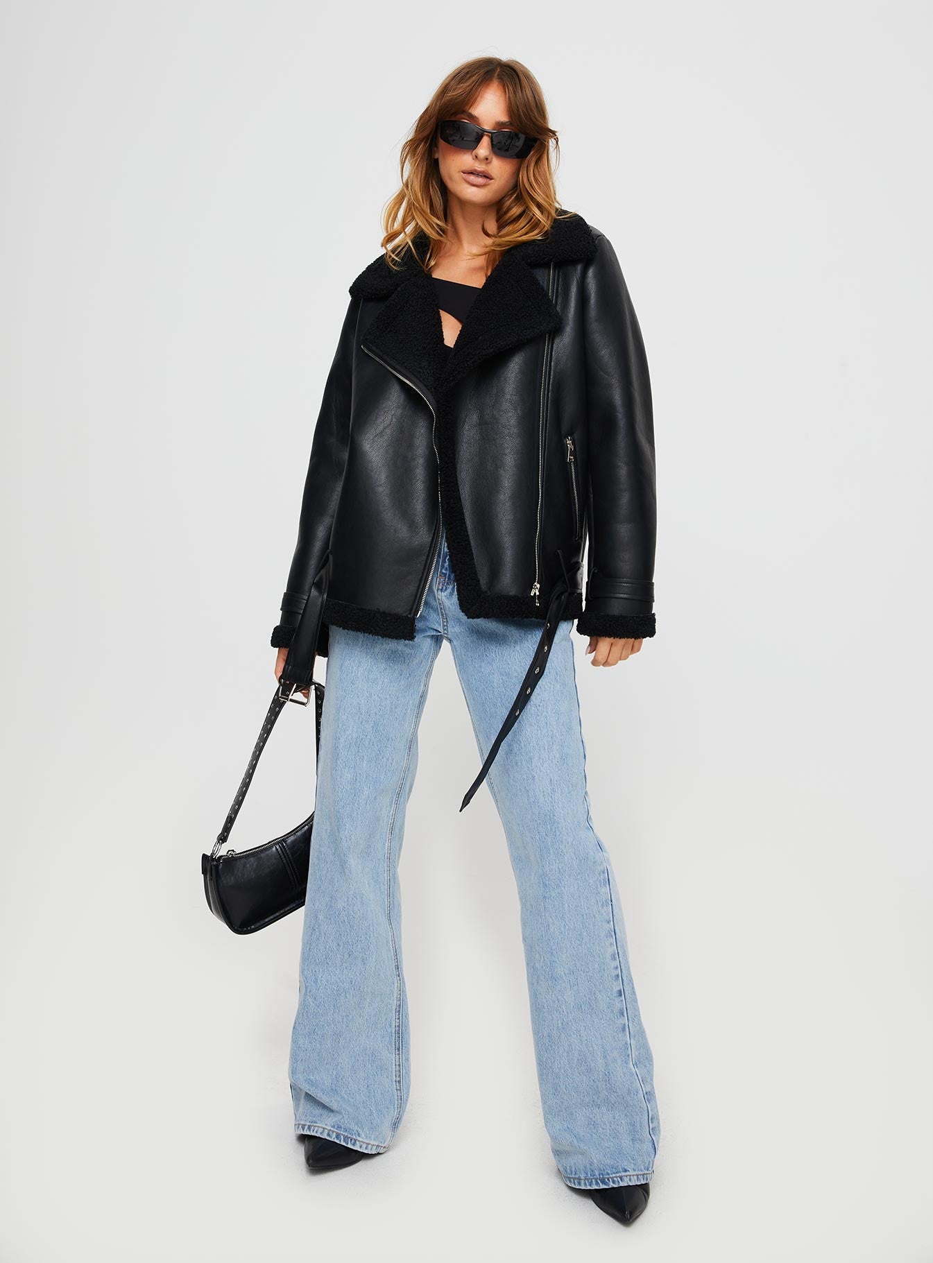 Faux leather jacket Silver-toned hardware, zip fastening down front, twin hip pockets, adjustable & removable belt Non-stretch material, shearling lined