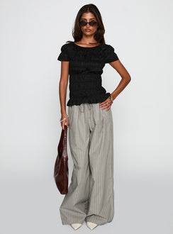 front view of model wearing Princess Polly Spoiler Alert Ruched Top Black Short Sleeves Scoop Neck 