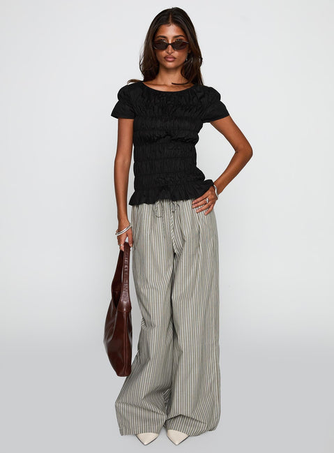 front view of model wearing Princess Polly Spoiler Alert Ruched Top Black Short Sleeves Scoop Neck 