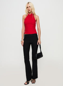 front view of model wearing Princess Polly Dafina Halter Top Red Sleeveless Cowl 