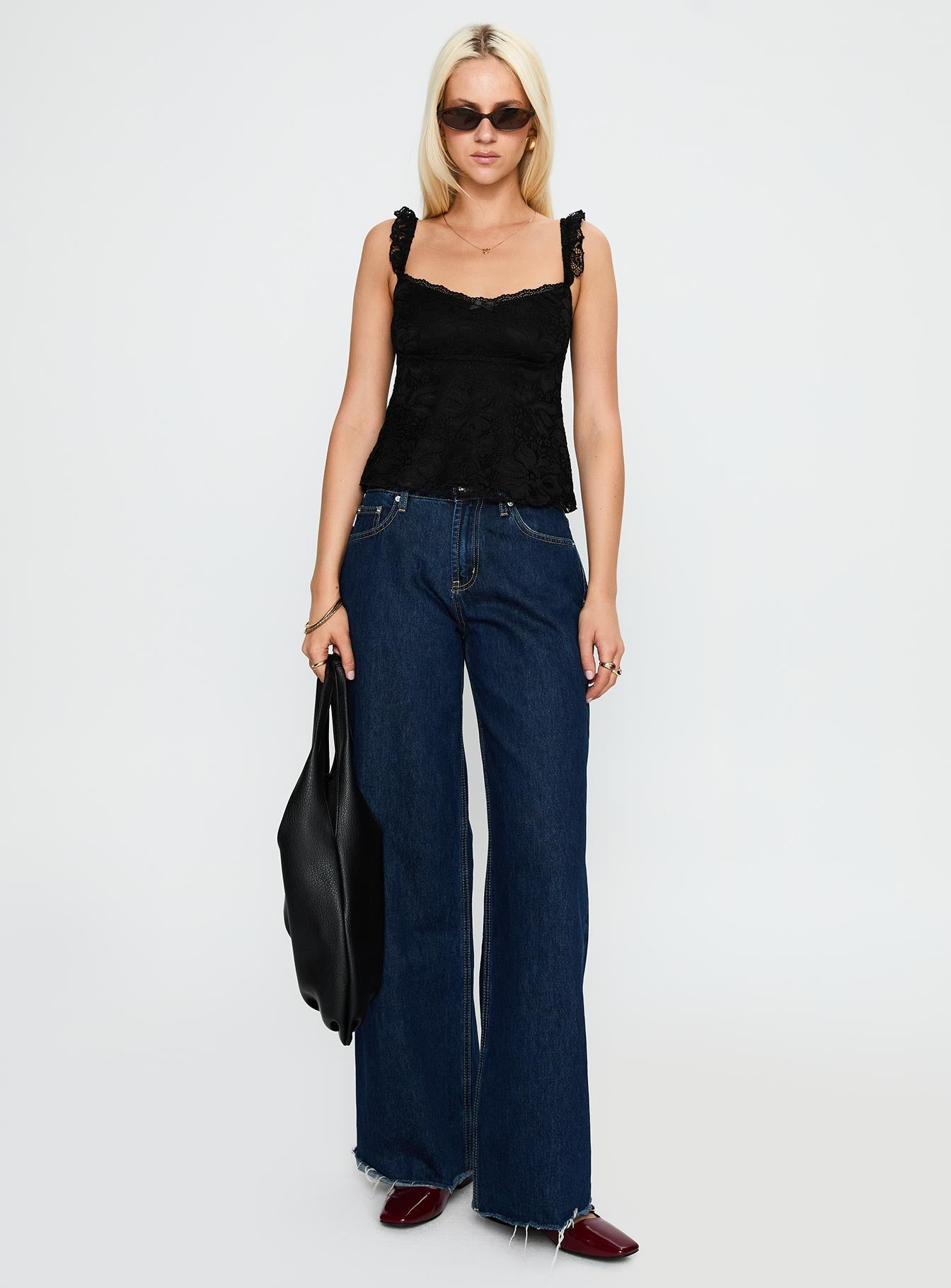 side view of model wearing Princess Polly Madaleine Lace Top Black Sleeveless Scoop Neck 