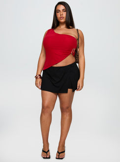 side view of model wearing Princess Polly For The Thrill Skort Black Curve High Waisted Shorts 