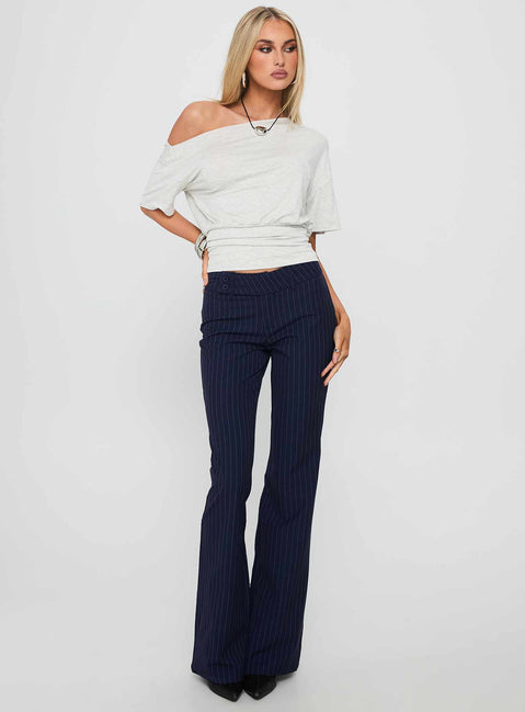 front view of model wearing Princess Polly Kinkirk Flared Pants Navy Pinstripe Low Rise Pants 