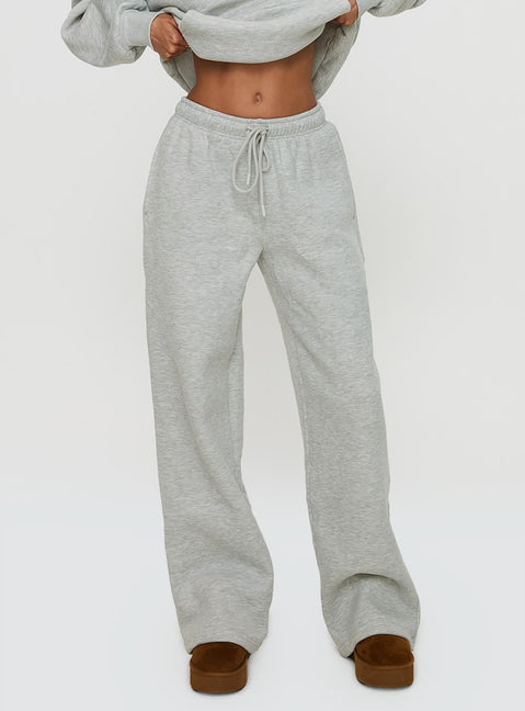 side view of model wearing Princess Polly Princess Polly Wide Leg Track Pant Bubble Text Grey Marle / Green 