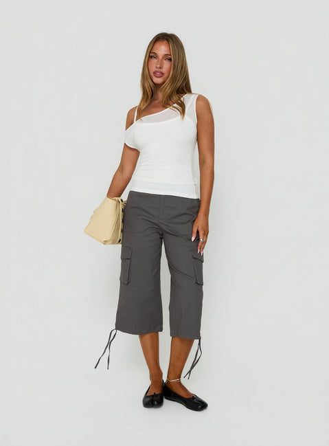 Featuring the Alfonza Utility Capri in Slate womens-regular-pants with mid-rise cargo styling front view of model wearing Princess Polly