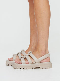 Sandals Chunky cleated outsole, open-round toe, padded T-bar upper design Padded Heel Strap with elastic for the perfect fit, padded Insole for superior comfort Faux leather