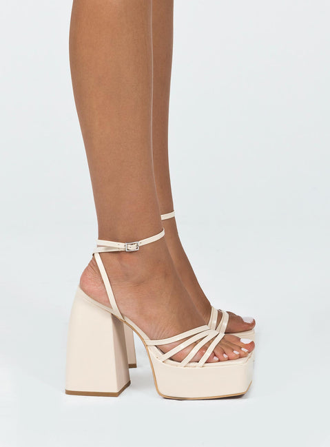 Platform heels  Faux leather material  Square toe Strappy upper Block heel  Ankle buckle fastening  Platform base 