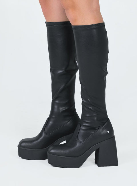 Boots  Faux leather material  Fitted at leg  Block heel Platform base  Square toe  Good stretch 