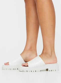 Faux leather slides Single thick strap upper, rounded toe, treaded sole, padded footbed