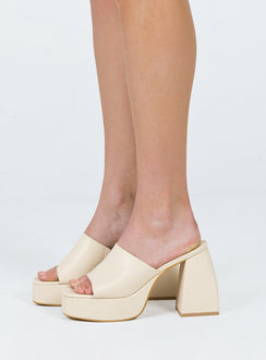 Cream mules Faux leather material Single wide upper Block heel Platform base