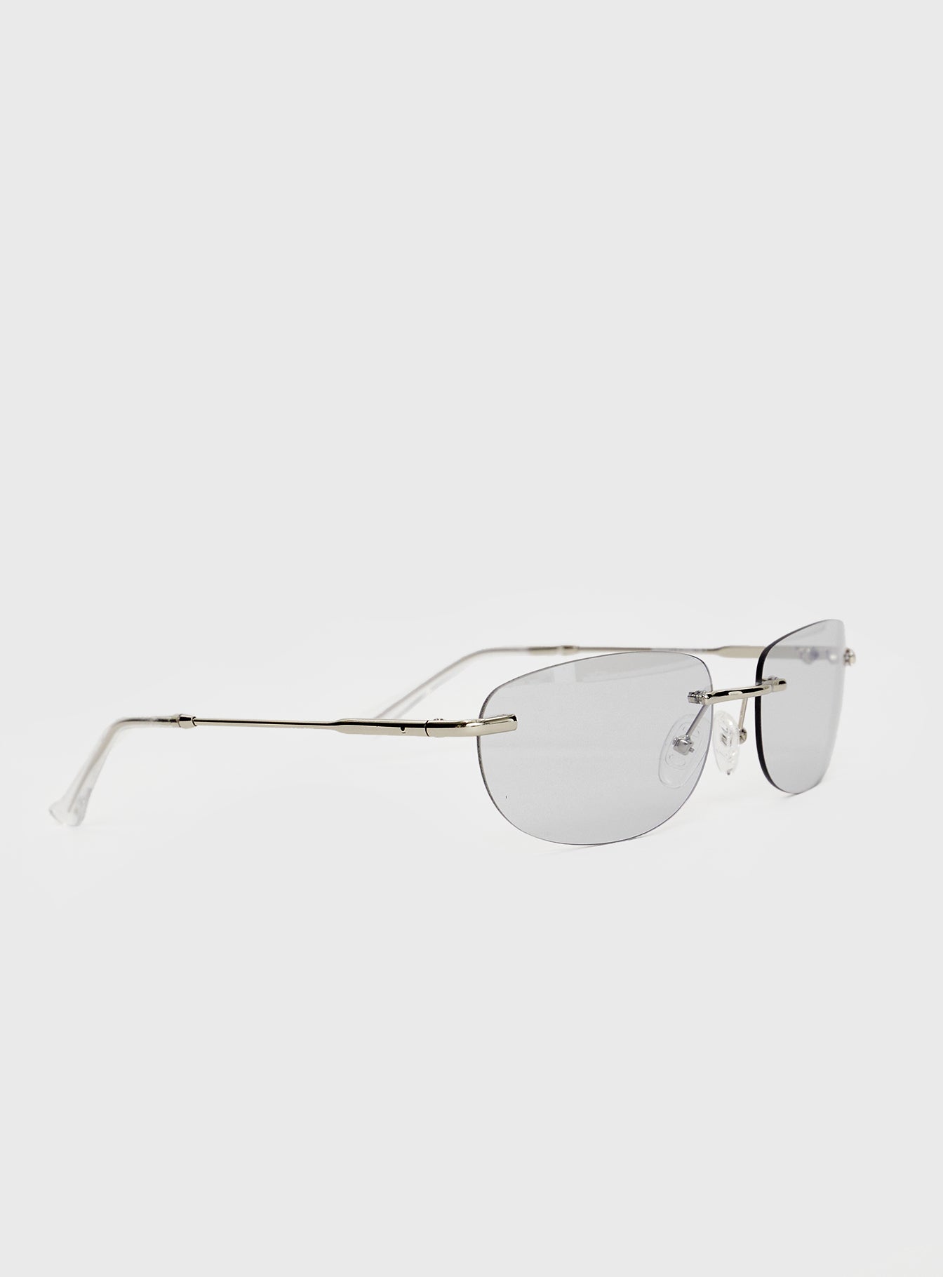 Sunglasses Frameless, grey-tinted lenses, slim silver-toned arms, silicone nose pads