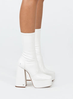 Boots  Faux leather material  Fitted at leg  Block heel  Platform base  Square toe  Slight stretch 